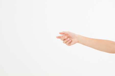 female hand holding invisible items, woman's palm making gesture while showing small amount of something on white isolated background, side view, close-up, cutout, copy spaceの写真素材