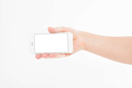 Hand holding white phone isolated on white. Top view.Mock up.Copy space.Template.Blank.
