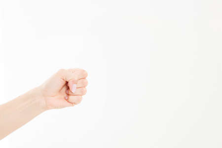caucasian female fist isolated on white background, arm hold somethingの写真素材