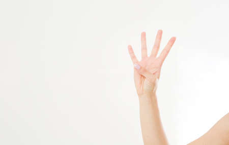 hand shows four fingers. Gesture. caucasian arm. Mock up. copyspace. template. blank.