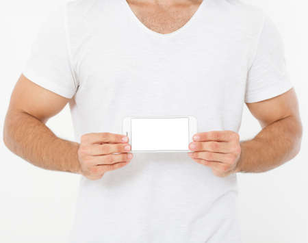 Strong man in t shirt hold blank screen phone isolated on white background, fitness apps. Top view,...