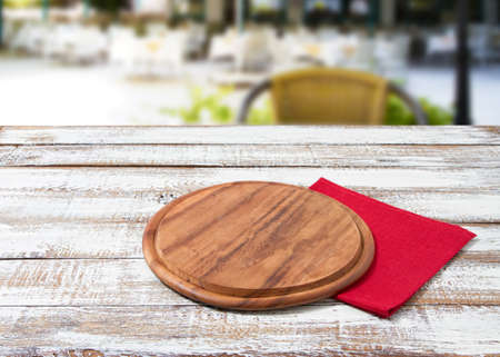 cutting desk, red napkin on wooden table on blurred restaurant, tableclothsの写真素材