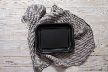 Black tray and tablecloth top view, empty board mockupの写真素材