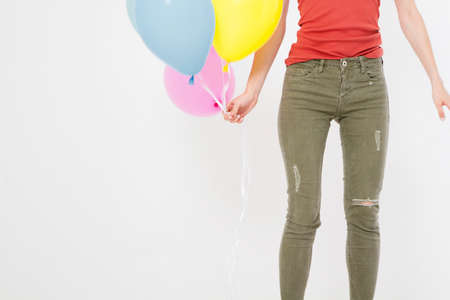 young woman girl with colored balloons isolated on white background. copy space