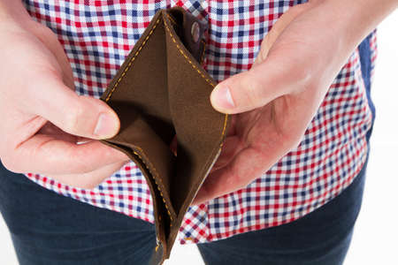 Bankruptcy - Male Person holding an empty wallet, hand holding Empty Wallet
