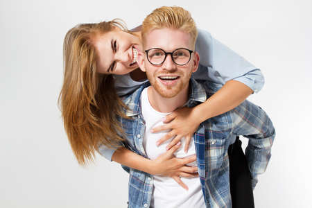Portrait of a beautiful emotional young happy smiling couple - isolated.の写真素材