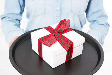Time gifts - gift box in hand girls, gift with red bow in hand isolated on white background, Hands...