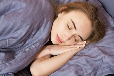 Woman sleep on bed in the night, healthy sleep, girl sleeps bedroom.