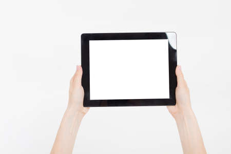 Hand holding black tablet isolated on white clipping path inside. Top view.Mock up.Copy space.Template.Blank.の写真素材