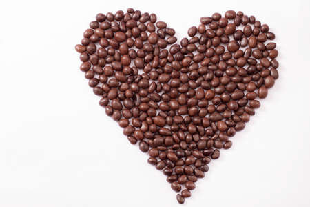 Candy and sweets isolated on white background. heart shape. top view. selective focus. copy space and mock upの写真素材