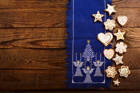 Frame of christmas sweet cookies on dark brown wooden background. Top view and copy space. Mock up. happy new year conceptの写真素材