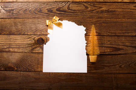 Christmas card and New Year accessories on brown wooden table. top view. Copy space and place for text.の写真素材