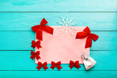 Christmas card with copy space on blue wooden background. top viewの写真素材