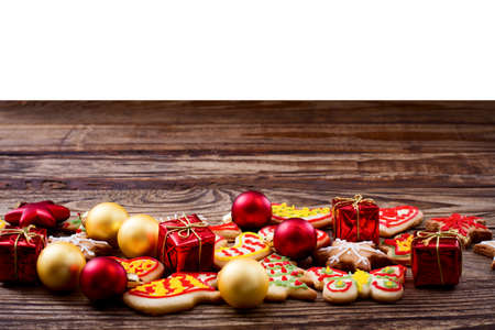 Christmas cookies on brown wooden table isolated on white background. Top view and mock up....