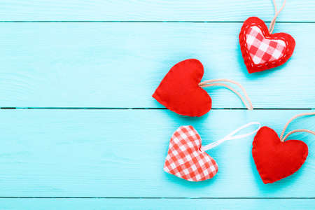 Hearts on blue wooden background. Valentine's day. Top view and selective focus