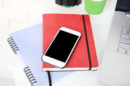Workplace with business accessories on blue wooden background. top view