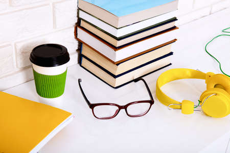 Workplace and education accessories on white table. selective focus