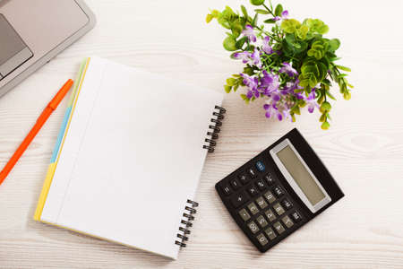 Creative workspace with work accessories and copy space on white wooden table. top view