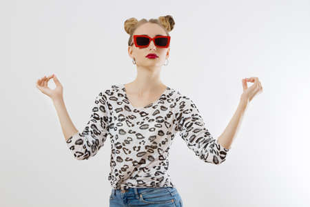 Happy woman isolated on white background. summer style. Red lipstick and sunglasses. Funny hairstyle and fun summertime. shopping concept.の写真素材
