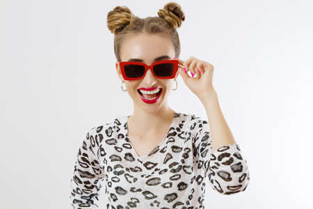 Close-up woman face. Fashion female closeup in trendy clothes isolated on white background. Summer...