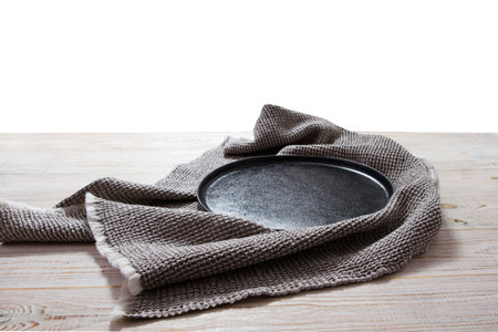 empty wooden round pizza tray and tablecloth on wooden background top viewの写真素材