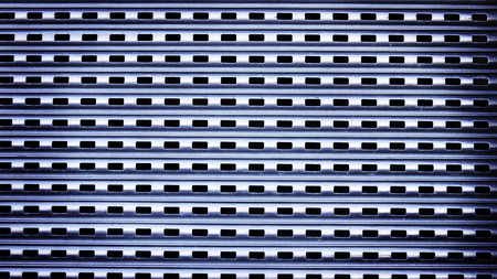 Holes making a pattern in metal wall.の写真素材