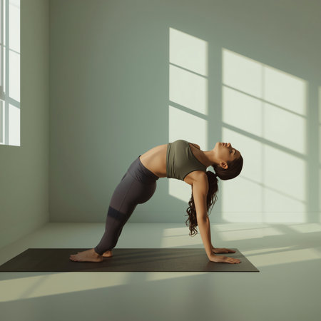 Young woman practicing yoga in a room with large windows. Yoga conceptの素材
