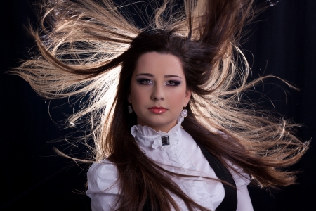 beautifull brunette , shooting in the studio with dark background の写真素材