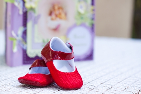 bebe shoes with a notbook with angles in the backgroundの写真素材