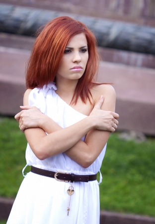 Portrait of a sad red hair girlの写真素材