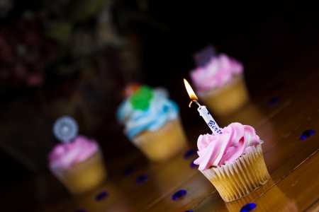 Close up of a cup cake on the wooden tableの写真素材