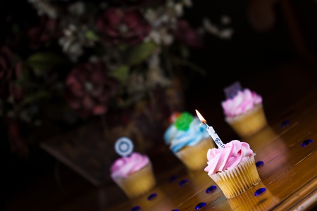 Close up of a cup cake on the wooden tableの写真素材