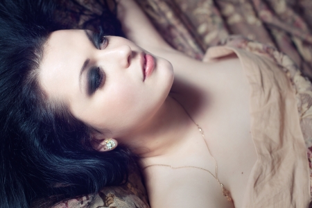 a close up portrait of a beautiful brunette の写真素材