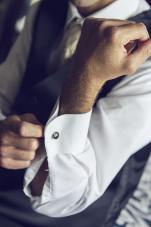 Groom getting ready at the wedding indoors