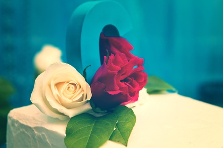 Wedding cake with floral decorations teal and ivoryの写真素材