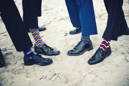 Groom's and groomsmen feet with funny socksの写真素材