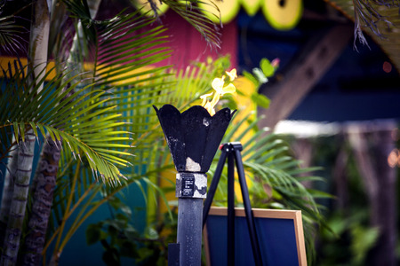 Close up of a tiki bar lid and burning outdoorsの写真素材