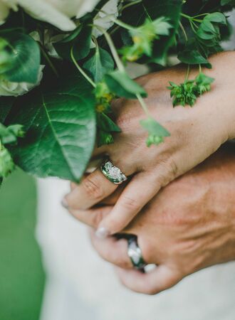 Groom and Bride holding handsの写真素材