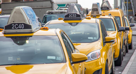NEW YORK - NOVEMBER 21, 2013  New York taxis waiting for clients New York City has around 6,000 hybrid taxisのeditorial素材