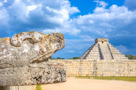 Chichen Itza pyramid and mayan head sculpture,Mexicoの写真素材