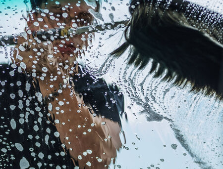Man cleaning a glass with brushの写真素材