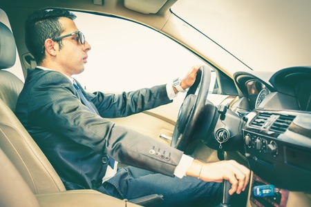 Elegant man driving his car