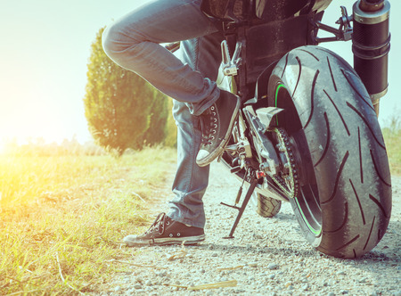 biker taking a break in the countrysideの写真素材