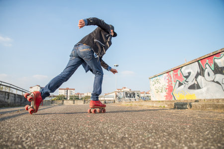 Cool man with roller skating shoes running - Concepts of youthness,sport,lifestyle and 80s vintage styleのeditorial素材
