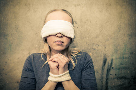 Kidnapped woman - Young girl victim of abuse and domestic violenceの写真素材