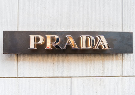 MILAN,ITALY - DECEMBER 30, 2014: Prada logo on a Milan boutique.Prada is a world famous fashion factory.のeditorial素材