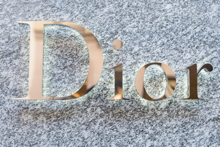MILAN,ITALY - DECEMBER 30, 2014: Dior logo on a boutique shop.Dior is a world famous fashion brand.のeditorial素材
