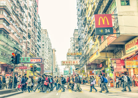 HONG KONG - FEBRUARY 12,2015:  People crossing streets in Hong Kong.There are more than 35 million of visitors arrived Hong Kong from January to Septemberのeditorial素材