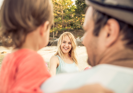 Happy family portrait - Father carrying his son on arms and looking at mom - Family and baby outdoors - Concepts about family,vacation and togethernessの写真素材