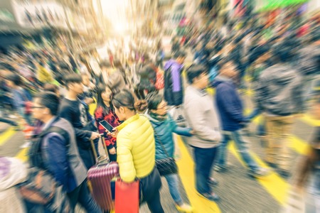 People crossing a streets - Crowd  in a city with radial blur - Concepts about traffic,urban life,shopping and lifestyleの写真素材